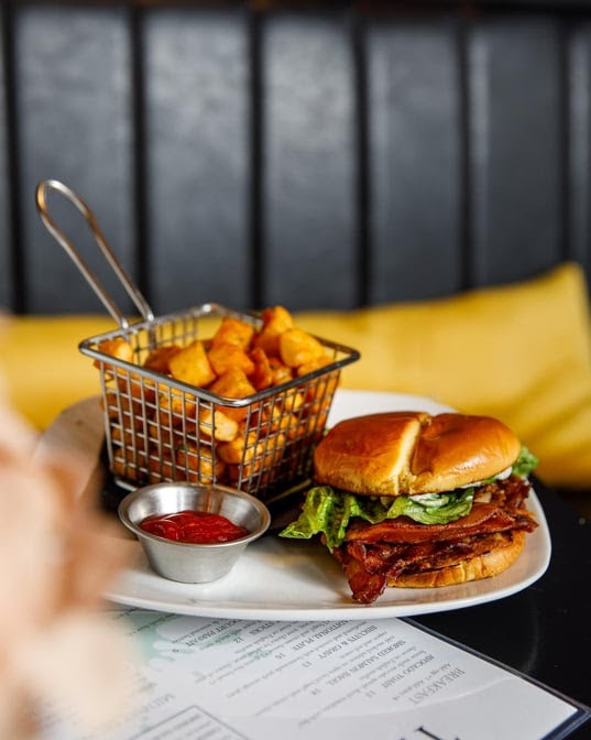 The Classic BLT at The Vick — Thick-cut bacon · brioche · seasoned tots