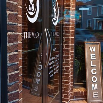 Southern brunch spread and sports bar seating at The Vick ATL in Roswell, GA