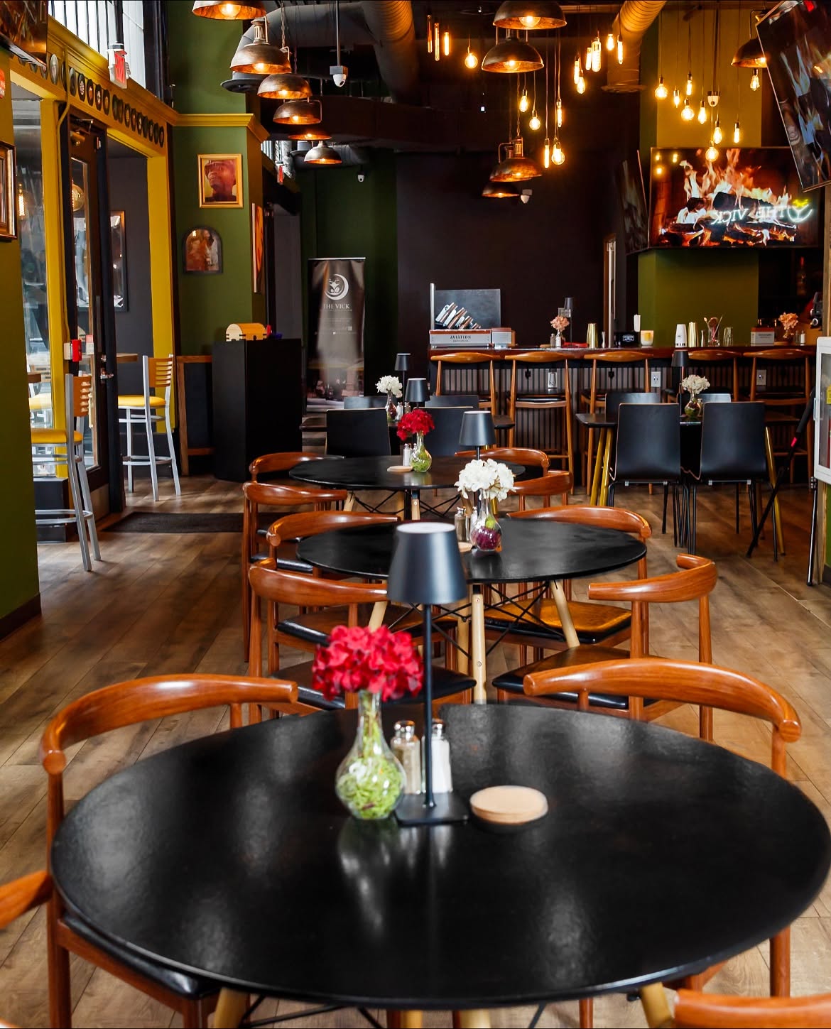 Sports bar seating with TVs and Southern dinner service at The Vick at Healey in downtown Atlanta